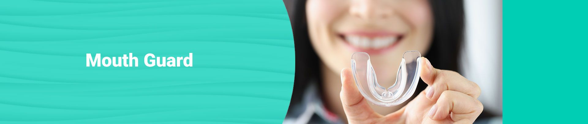 Smiling woman holding a clear mouth guard